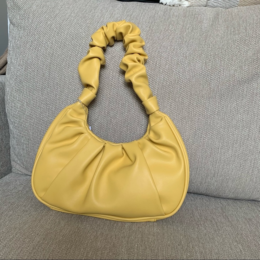 Yellow shoulder bag.